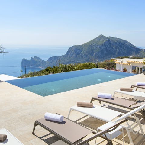 Watch the sunset from a lounger or from the infinity pool