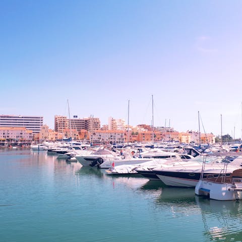 Visit the idyllic Vilamoura, just a nine-minute drive away