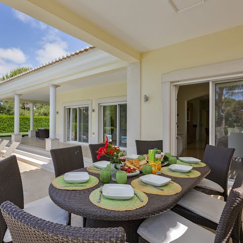 Enjoy alfresco meals by the dining table 