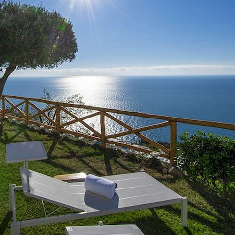 Sunbathe out on the garden's chaises longues while taking in views of the ocean
