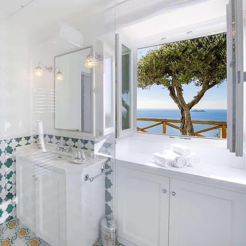 Wake up and brush your teeth overlooking views for days at the bathroom window