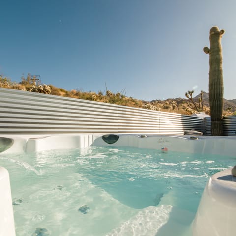 Unwind in the hot tub while taking in glorious desert views