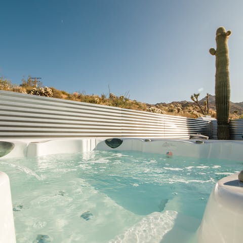Unwind in the hot tub while taking in glorious desert views