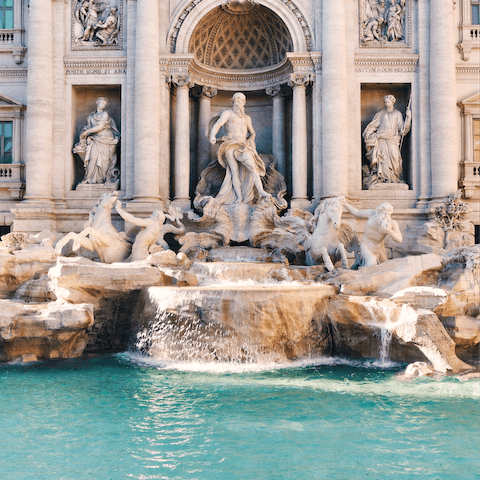 Make a wish at the Trevi Fountain, a three-minute walk away