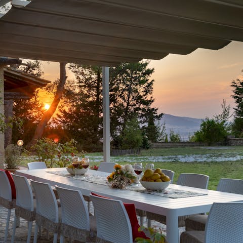 Enjoy an alfresco dinner as the Tuscan sun sets