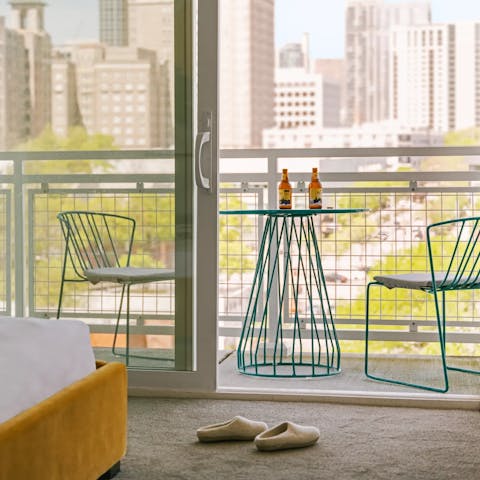 Head out onto the balcony for a blast of fresh air and gaze out at your towering neighbours