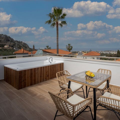 Sip an ouzo on the private balcony or luxuriate in the hot tub