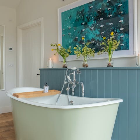 Enjoy a relaxing soak in the lavish roll top bath after a long day of rambling