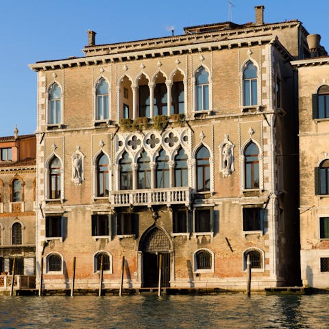 Arrive by water taxi at the private water door of your 15th century palazzo