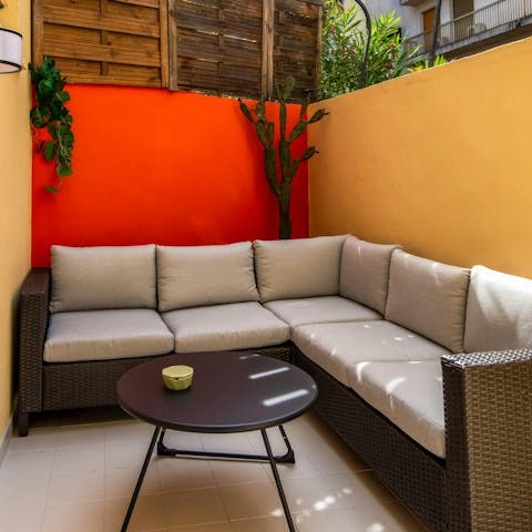 Enjoy a glass of Champagne in the colourful courtyard garden