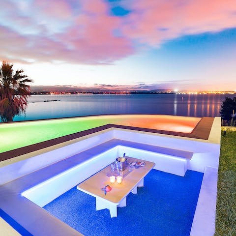 Enjoy evening aperitifs poolside as you watch the sunset