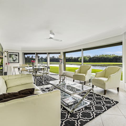 Relax in the bright living area and admire the views of the water