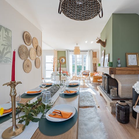 Gather round the table by the decorative fireplace and dine in style