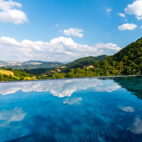 Bask in the views from the edge of your private infinity pool