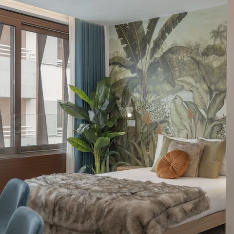 Awake in the jungle-themed bedroom and open up the curtains to let the sunshine in