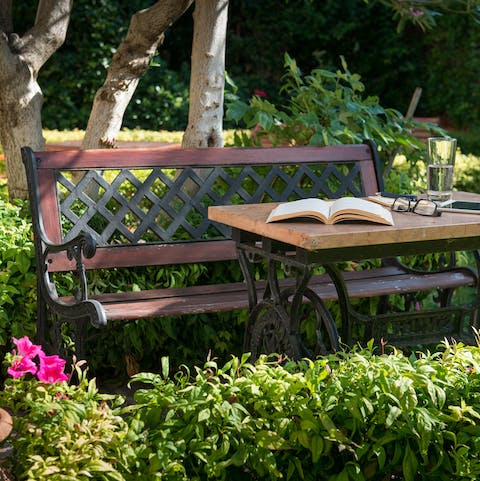 Settle down in the luscious garden with a good book and a cool drink