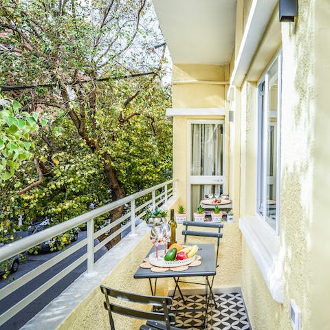 Sit among the trees and enjoy an Israeli breakfast on your balcony