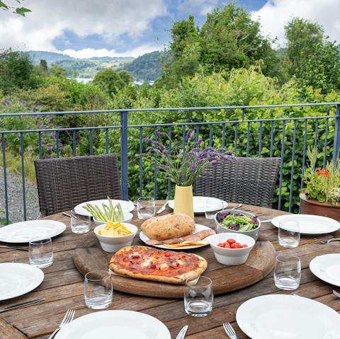 Dine alfresco in south-facing balcony with views over the lake and surrounding hills