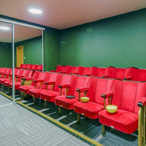Watch a movie in the old school home cinema room  