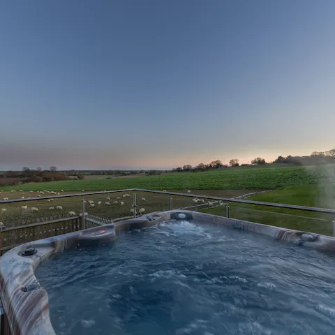 Unwind in the jacuzzi hot tub while counting the sheep over Romney Marsh