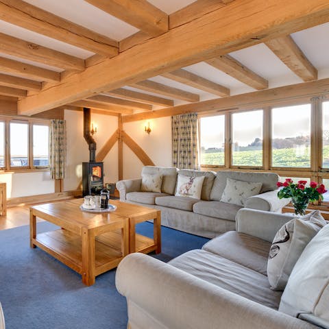 Curl up in front of the log burner fire after a day of exploring the surrounding countryside