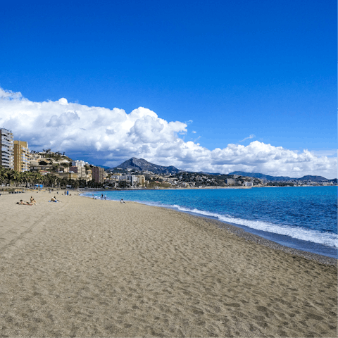 Spend leisurely days at Malagueta Beach, a twelve-minute walk away