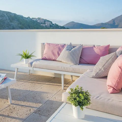 Kick back on your outdoor sofa, enjoying a nice drink as you watch the sun dip behind the mountains