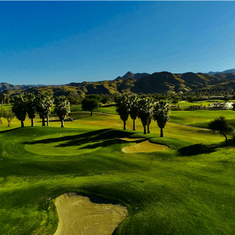Tee off on one of La Quinta's world-famous golf courses – Tradition Golf Club is just a five-minute drive away 