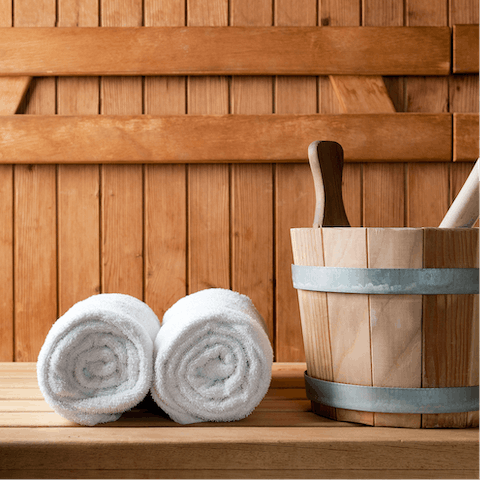 Put on your complimentary bathrobe and unwind in the sauna