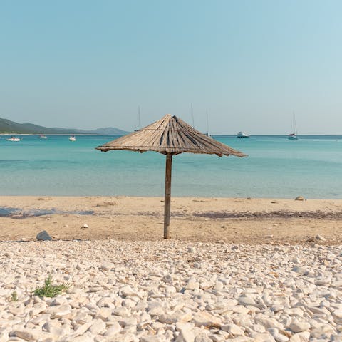 Swim in the crystal clear waters of Barbati Beach, 500 metres from your home