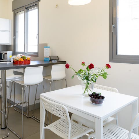 Share your meals in the dining area, which also serves well as a laptop-friendly workspace 