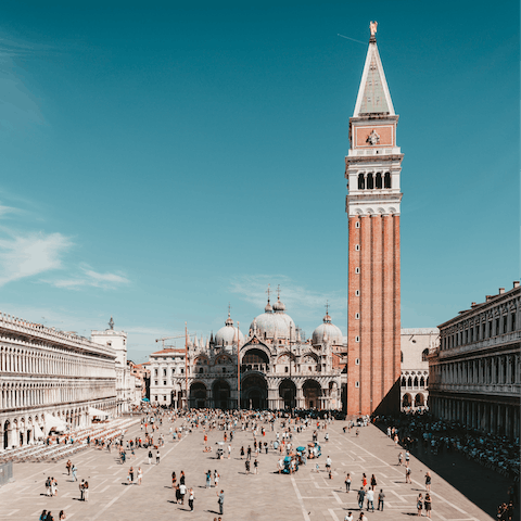 Visit bustling St. Mark's Square, an eight-minute walk away