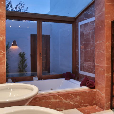 Soak in the jacuzzi tub in the master bedroom