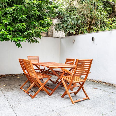 Gather for cocktails on the sunny terrace