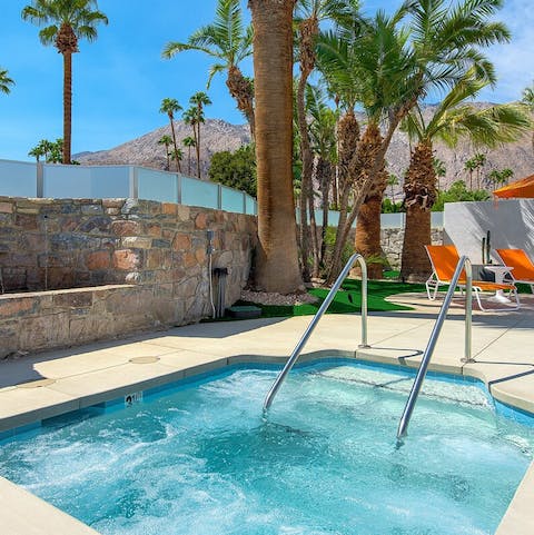 Have a soak in the shared jacuzzi, surrounded by palm trees