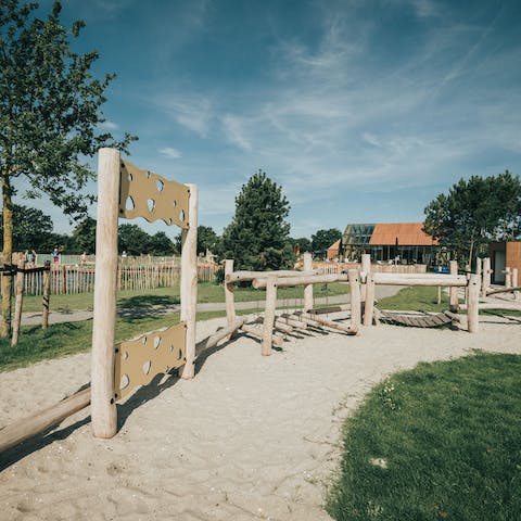 Watch your children make friends in this sandy playground area, also on-site