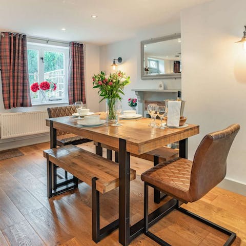 Share a delicious home-cooked meal around the wooden dining table 