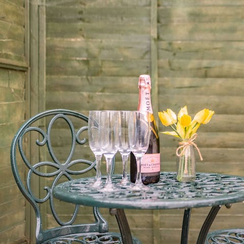 While away sunny afternoons in the enclosed garden, a glass of bubbly in hand