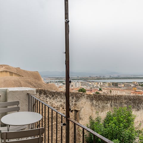 Gaze out over Cagliari's rooftops and the Med from the apartment's balcony