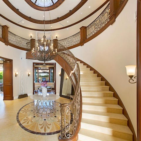 Make a grand entrace down the palatial central staircase