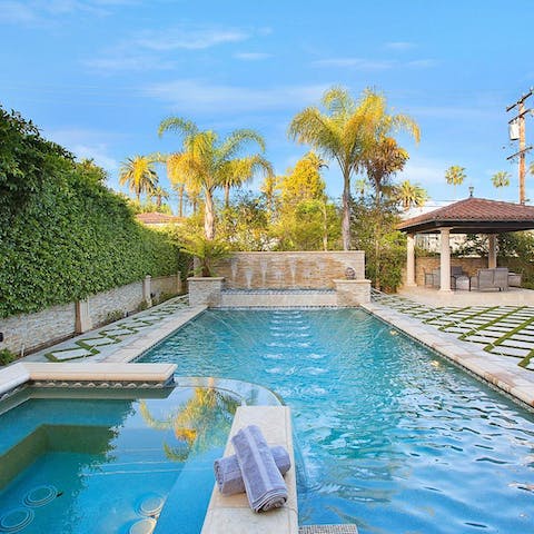 Swim laps or soak in the spa of the Roman-style pool