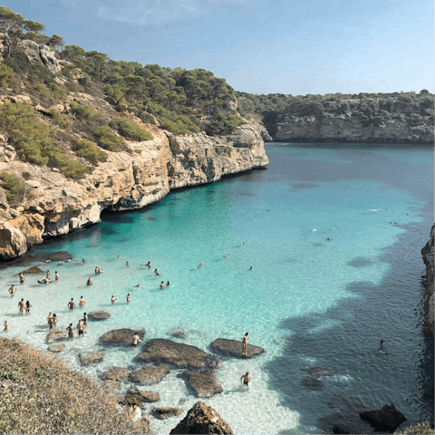 Head to the small cove of Caló des Moro and swim in the sea