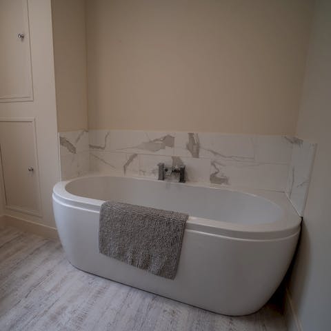 Treat yourself to a soak in the freestanding tub after a busy day