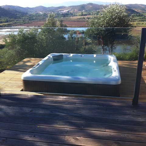 Take in the rolling green hills from the bubbling hot tub