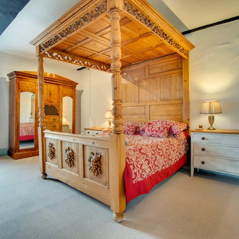 Wake in the magnificent four-poster bed, ready for another day in the great outdoors