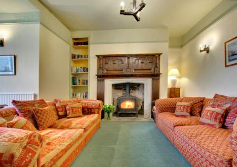 Settle down in front of the cosy log burner after a day out hiking the hills