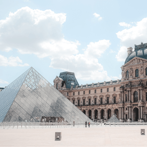 Visit the Louvre Museum, a short walk away