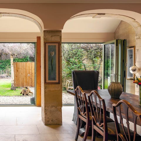 Open the bi-fold doors and enjoy breakfast with a garden view