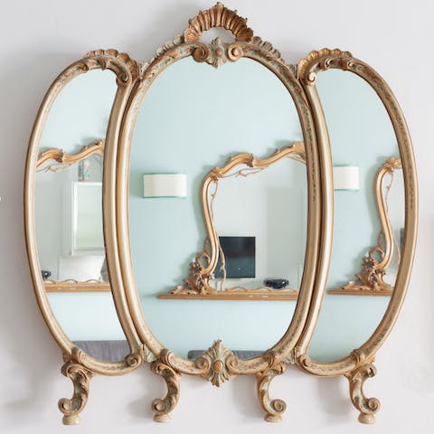 Admire the antiques, including gold mirrors and  rustic 