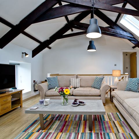 Chill out in the cosy living space underneath original timber beams